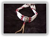 Three-strand choker, genuine bone hair pipe, glass beads, metal beads, leather ties with or without concho center.  We have 2- and 4- strand chokers available also.  Assorted colors.  (J-1B-C or J-1B)t
