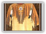 This great shirt is shown with red ochre powder paint, long fringe on bib, feathers, etc.  One of our very best selling garments.