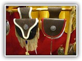 An assortment of the belt pouches, Cowhide, deer leather, concho, glass and metal beads.