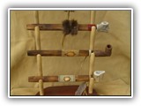 Pipes and display.  The stems are wood and the bowls may be clay or antler, depending on availability.  Assorted sizes and decorations are available.  The display is also available.  Very nice!